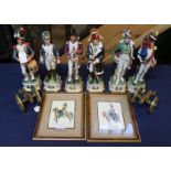 Six ceramic figurines depicting French Napoleonic Regiments with two brass model cannons and two