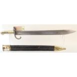 A Belgium model 1868 Pioneer (sawback) bayonet with brass mounted leather scabbard