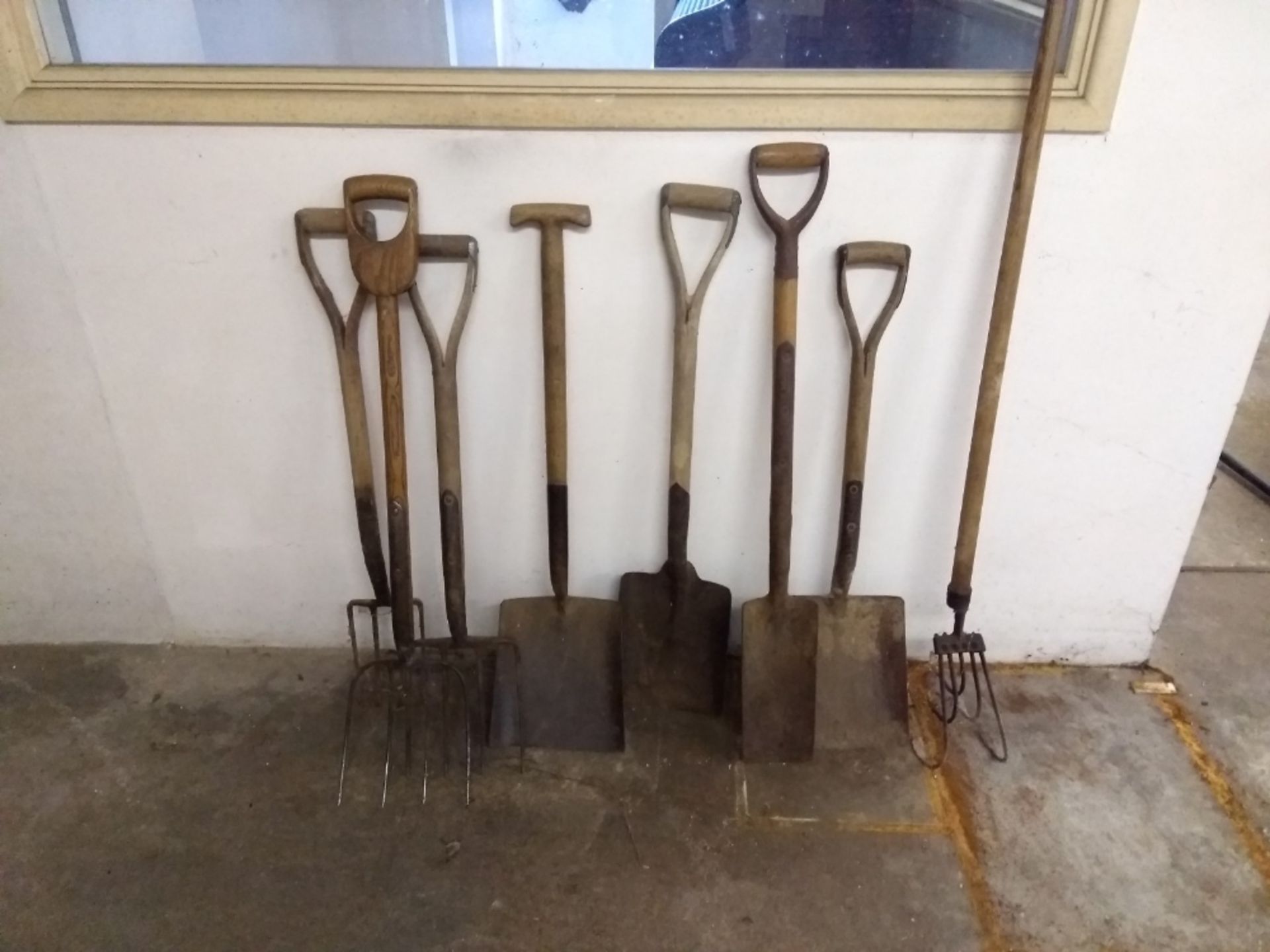3 x wooden handled forks - 4 x shovels - 1 x hoe fork
