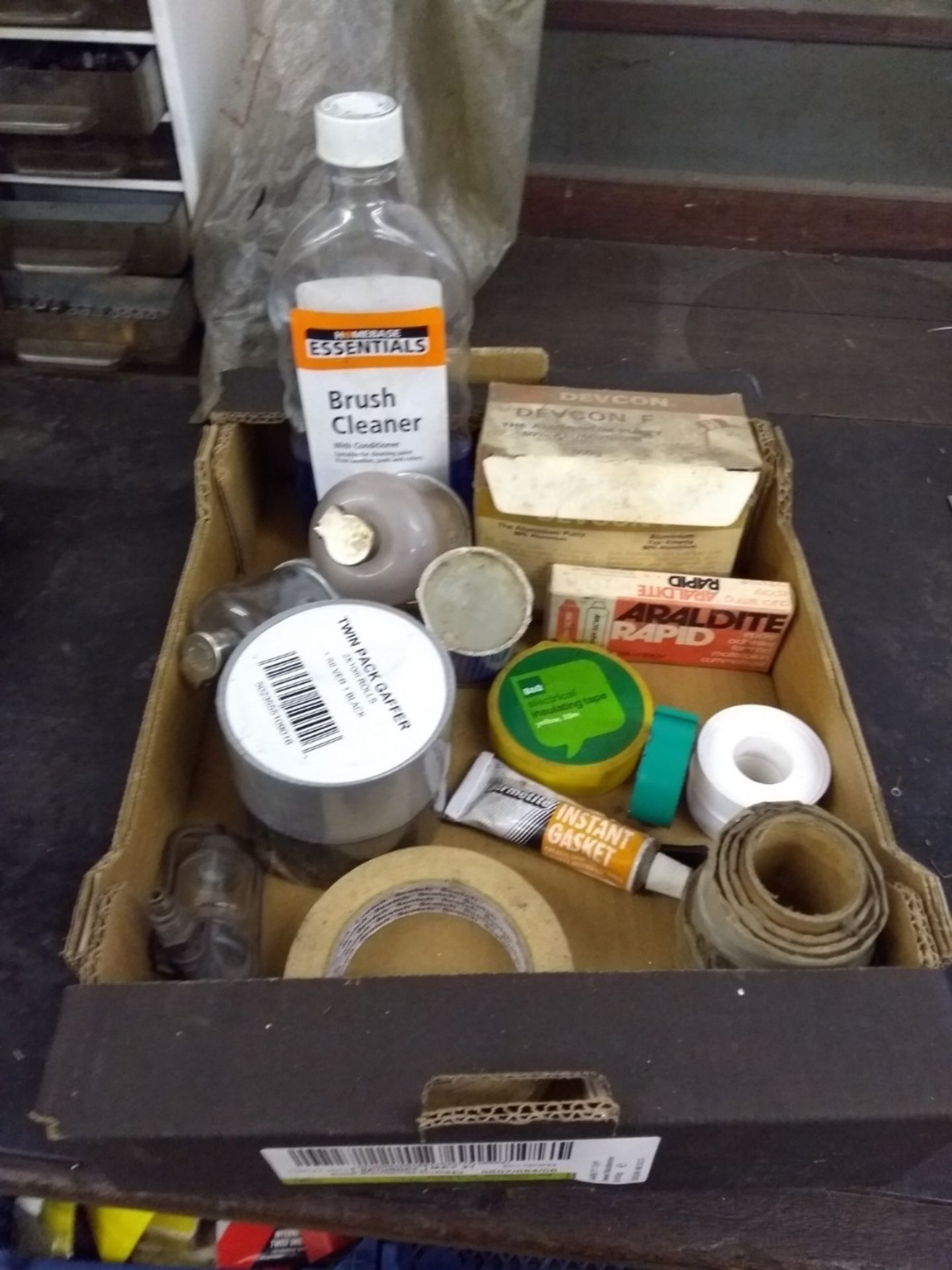 Small box of thread seal tape, gaffer tape, brush cleaner, masking tape,