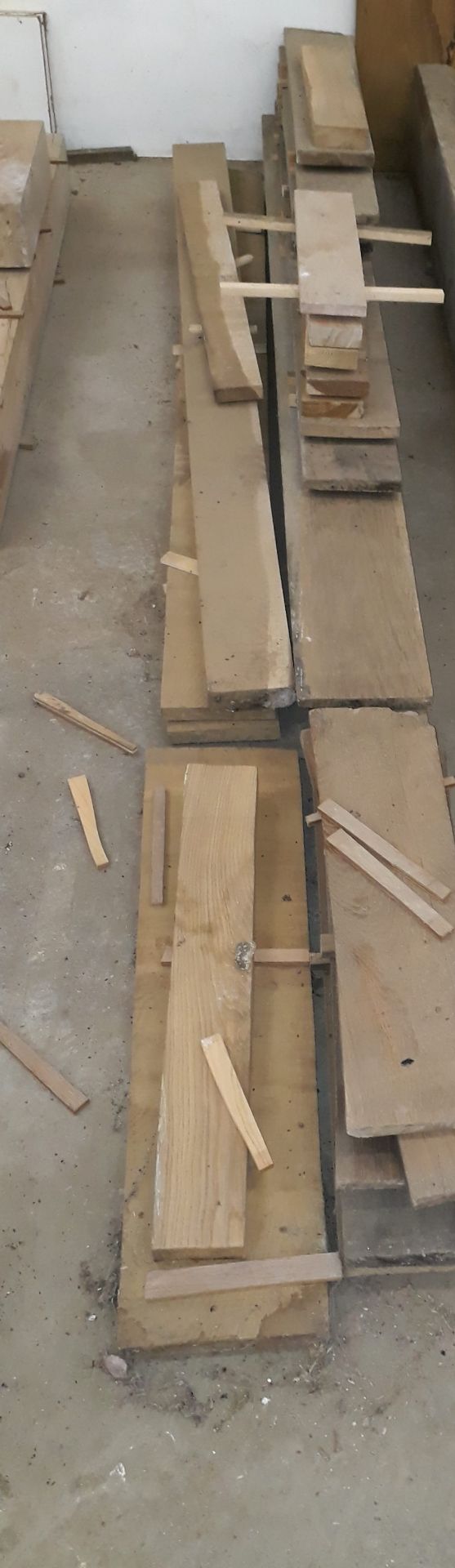 4 small heaps of cut and planed timber