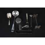 A mixed silver lot including mother of pearl handled caddy spoons, cruet spoons, pill pot, ladle,