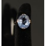 A 9ct gold ring set with faceted blue stone,