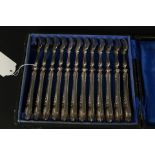 A set of twelve continental silver cake forks with filled handles (handles have a monogram)