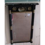 A Regency black and gilt pier mirror