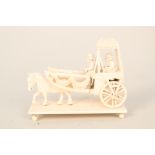 A vintage Indian ivory carving of a horse and carriage