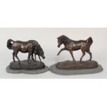 Two composition horses on serpentine bases,