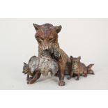 A cold painted bronze fox with cubs and duck,