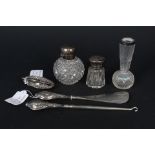 A silver topped cut glass scene bottle, a small similar, a silver rimmed glass bud vase,