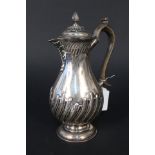 A silver coffee pot with ribbed detail on pedestal base by William Hutton & Sons,