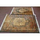 Two orange ground Persian pattern rugs