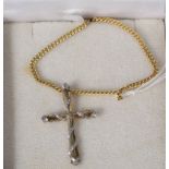 A 9ct yellow and white gold diamond set cross on 9ct gold chain