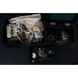 Two jewellery boxes with costume jewellery contents including earrings, brooches,