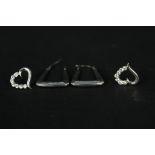 A pair of 9ct white gold hoop earrings and a pair of 9ct white gold heart shaped studs set with