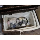 A basket containing mineral specimens and fossils