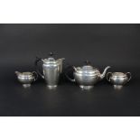 A silver four piece tea set and a pair of silver sugar tongs, tea set hallmarked Birmingham,