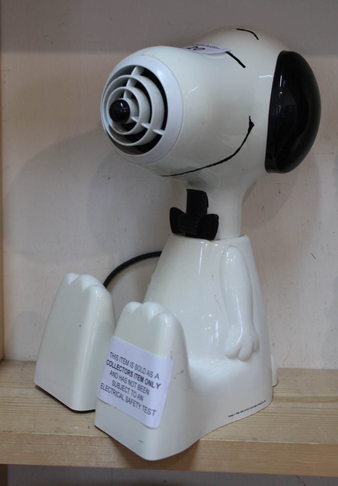 A Snoopy hair dryer (this item is sold as a collectors item only and has not been subject to an