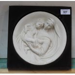 An Italian circular plaque of Madonna and child, signed A.