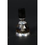 A miniature scent bottle mounted in white metal,