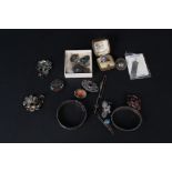 A quantity of silver jewellery including Scottish hardstone set brooch, engraved bangles,