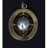 An Edwardian 9ct gold pendant set with large blister pearl