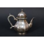 A silver teapot,