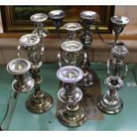 A pair of silver plated three light candelabra plus two others