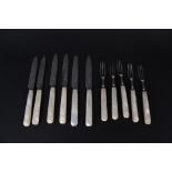 Five silver bladed mother of pearl handled dessert forks and six silver bladed mother of pearl