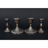 Two pairs of silver candlesticks (both as found)