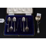 A boxed set of five (of six) teaspoons and matching sugar nips together with a silver sauce ladle