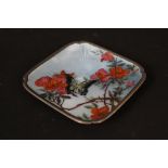 A very pretty silver enamelled dish on four bun feet decorated with floral and butterfly design,