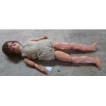 A porcelain head composition body doll,