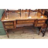 A 19th Century French walnut desk with galleried upstand