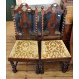 A pair of barley twist dark wood high back hall chairs