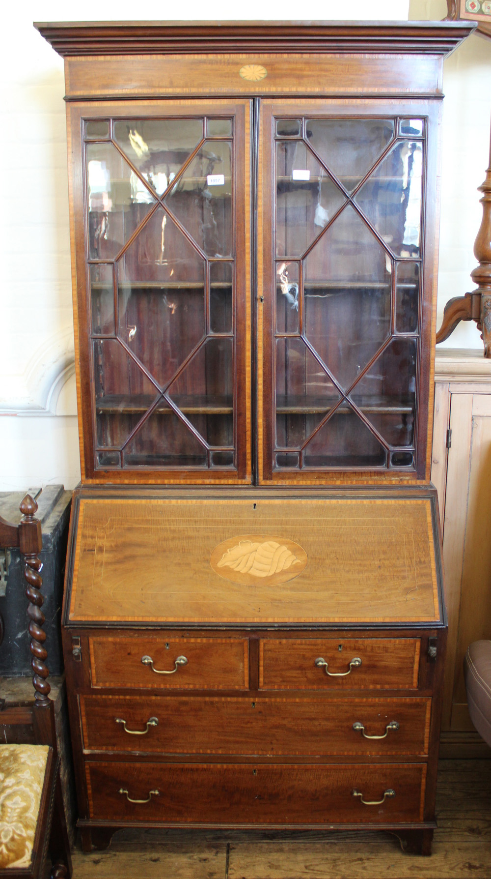 An Edwardian inlaid mahogany bureau bookcase