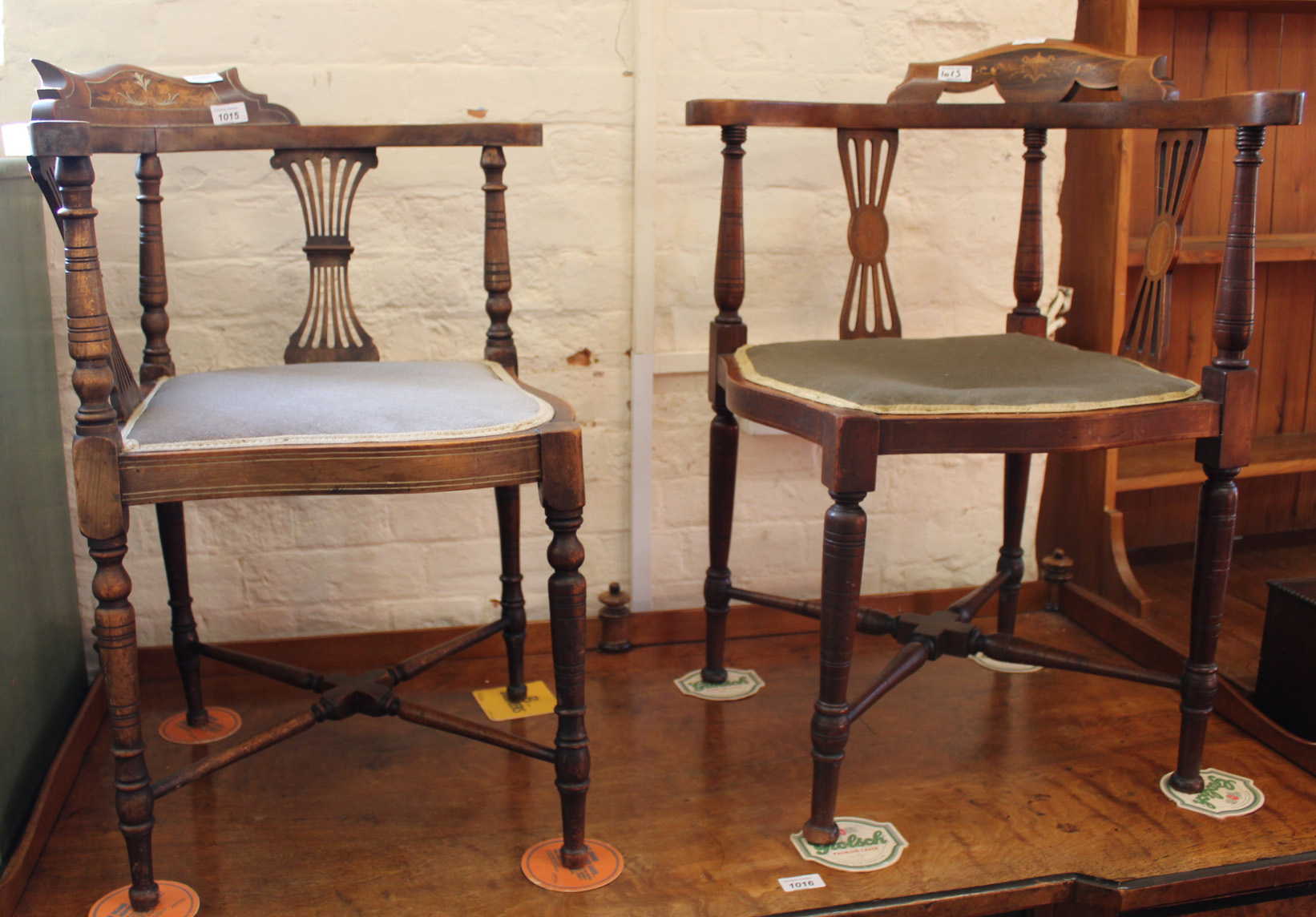 A matched pair of Edwardian inlaid mahogany corner chairs