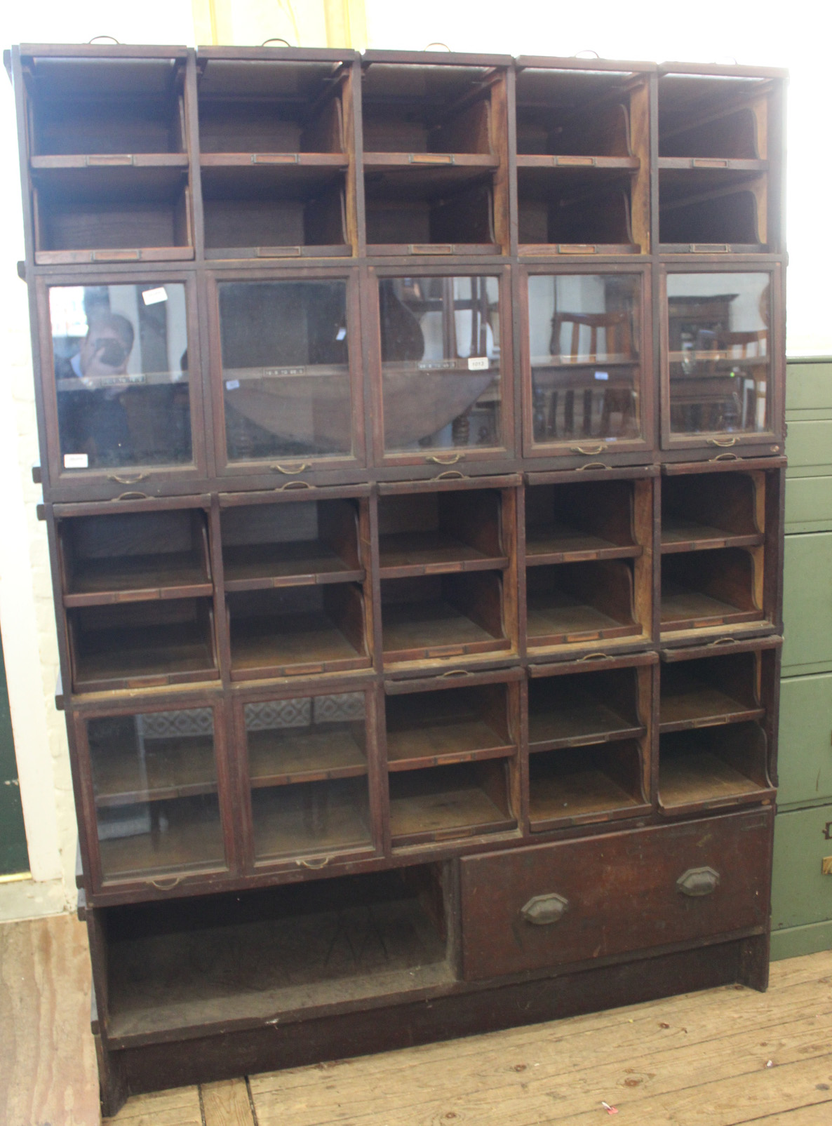 A large Edwardian pine and mahogany shop fitting unit