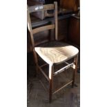 An Edwardian beech and elm clerk's chair