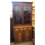 An Edwardian inlaid mahogany two door glazed cabinet on Edwardian satinwood two drawer two door