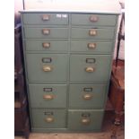 A late Victorian green painted pine bank of twelve drawers