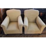 Two yellow upholstered low armchairs