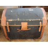 A vintage leather domed top travelling trunk