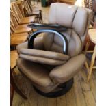 A Stressless style chocolate brown armchair and matching stool