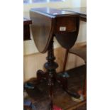 A 19th Century burr walnut oval drop leg table on ornately carved quadrical supports