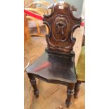 A 19th Century carved oak hall chair