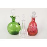 A Victorian green glass claret jug plus two decanters