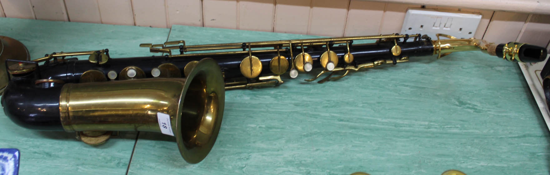 A brass and black finish tenor saxophone marked O Borgani,