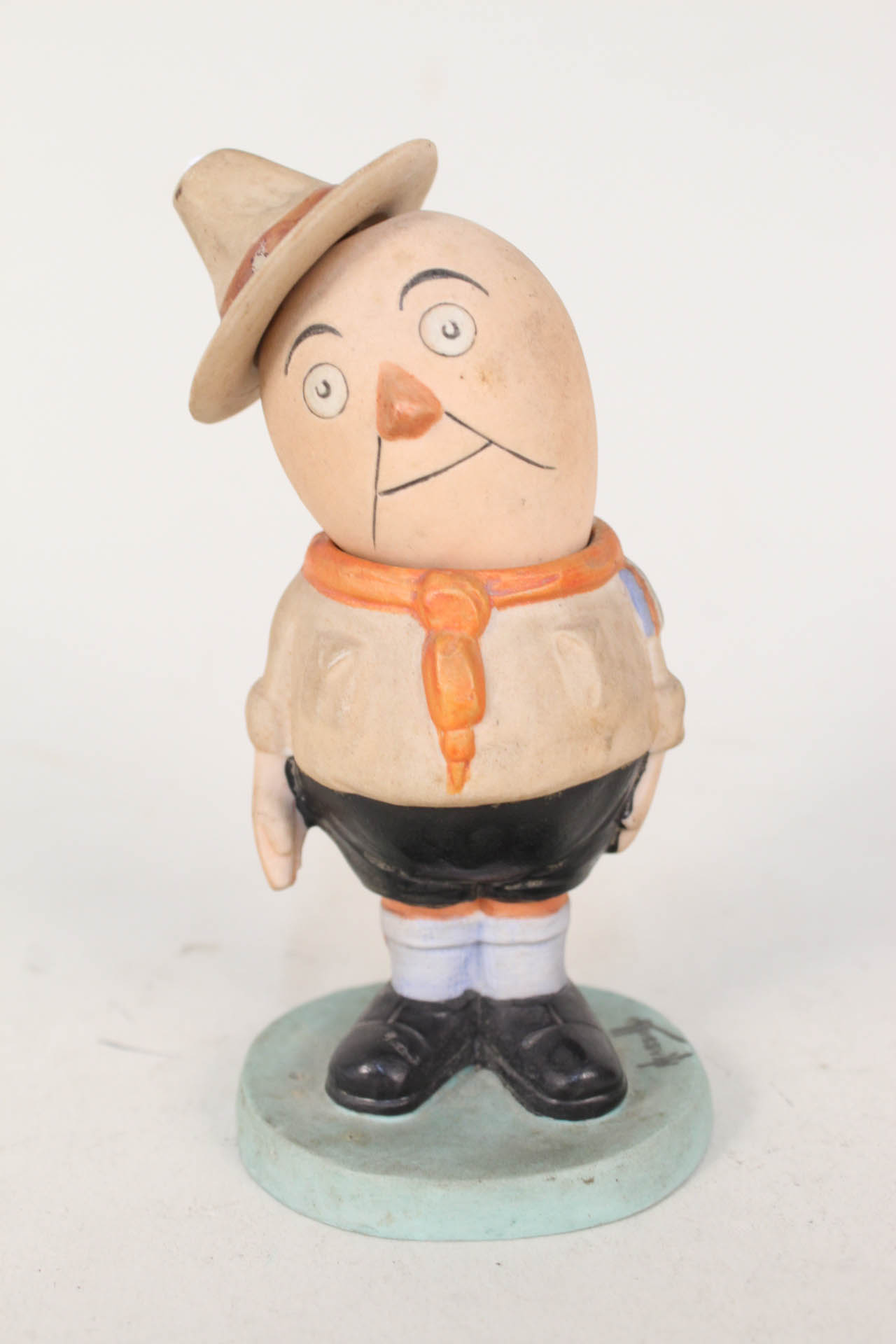 A Hassall bisque figure of a boy scout,