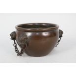 A Chinese bronze bowl with dragons head handles and seal mark,