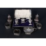 A mixed lot including boxed silver three piece cruet with weighted bases (as found),